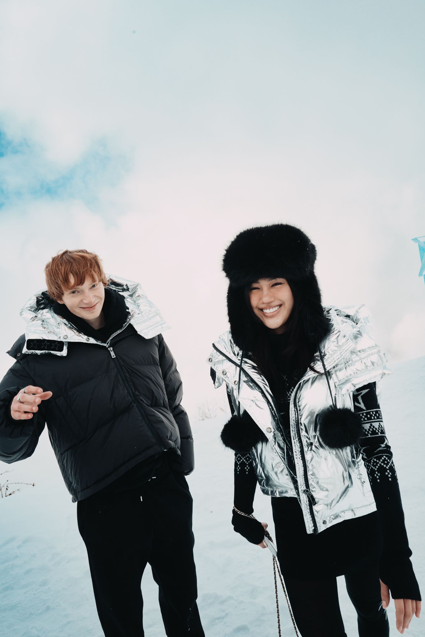 Image may contain clothing, coat, photography, face, head, people portrait, adult, outdoor and snow