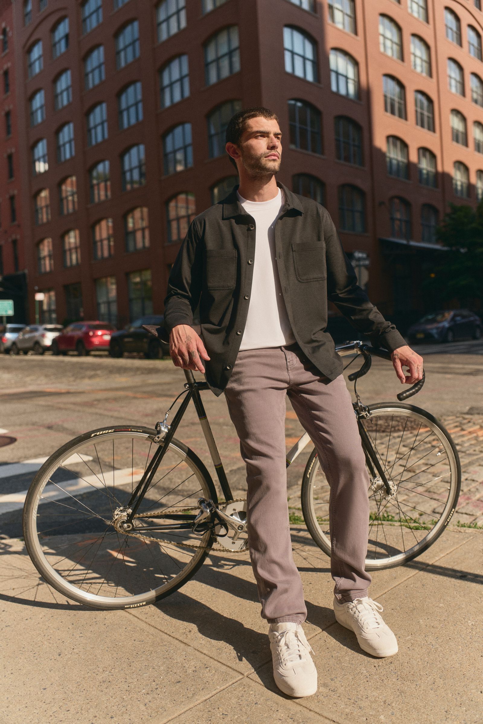 Image may contain standing people, adult wheels, bicycles, transit vehicles, clothing, outerwear and pedestrians