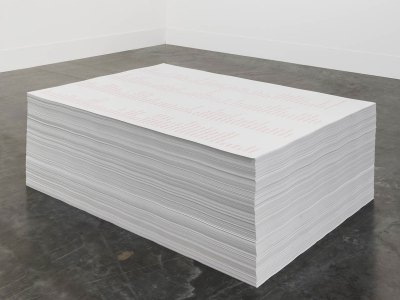 There is a stack of posters on the floor. 