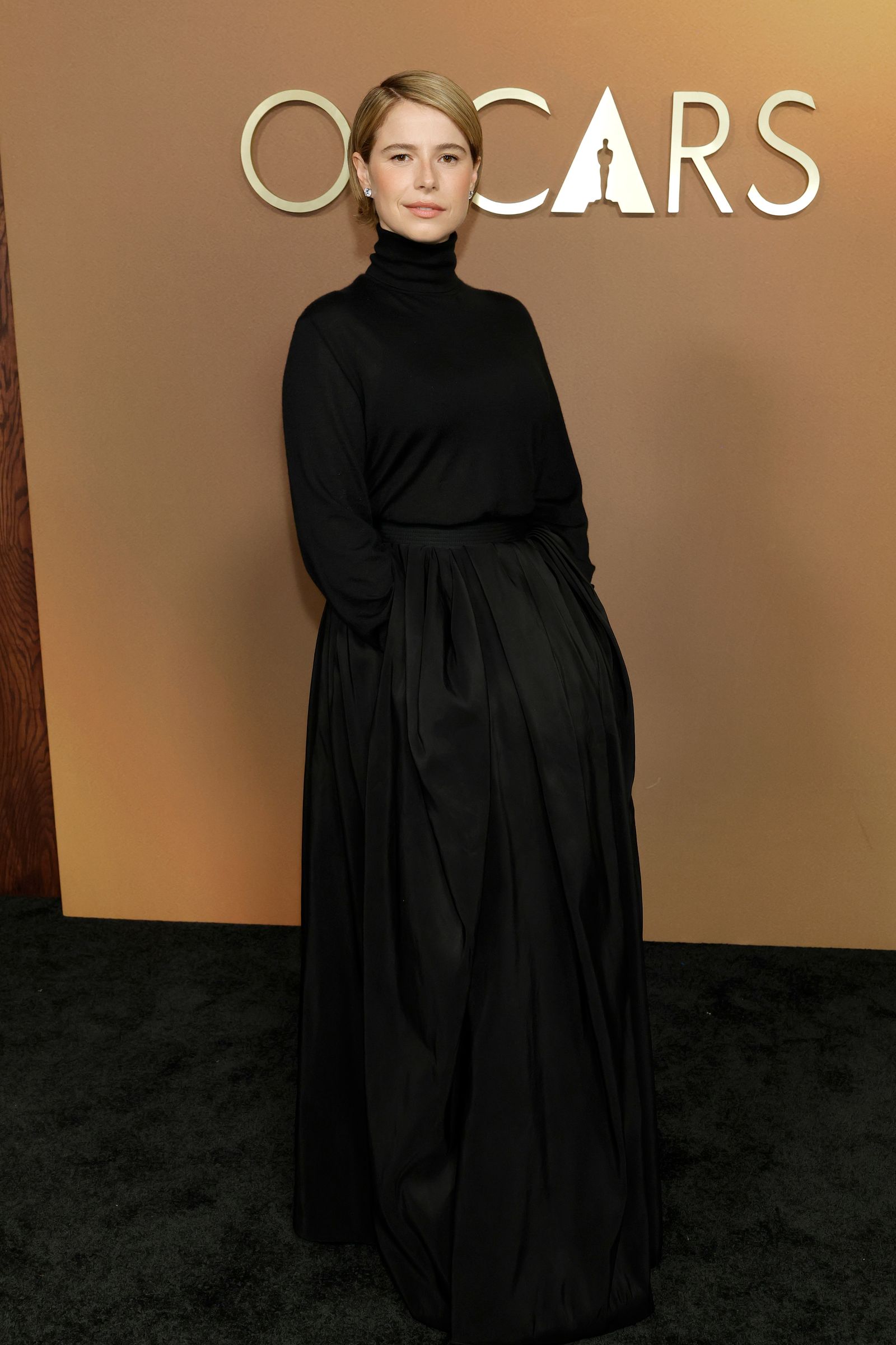 Image may contain adult fashion clothing dress formal long sleeve evening gown face and head