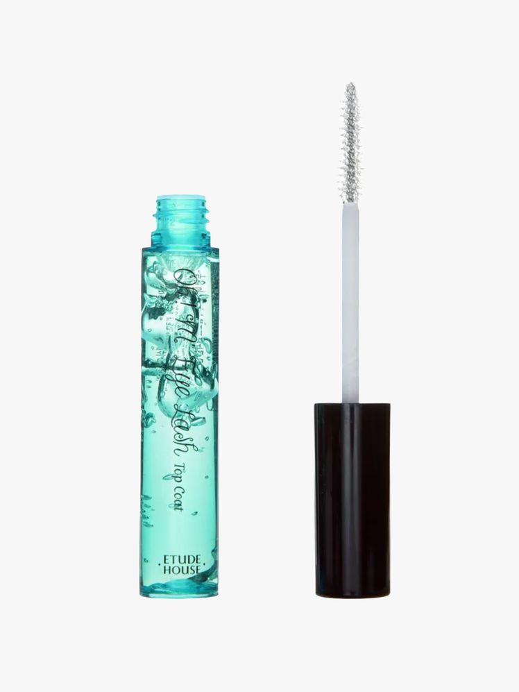 Image may contain: cosmetics, cigarette pipe and mascara