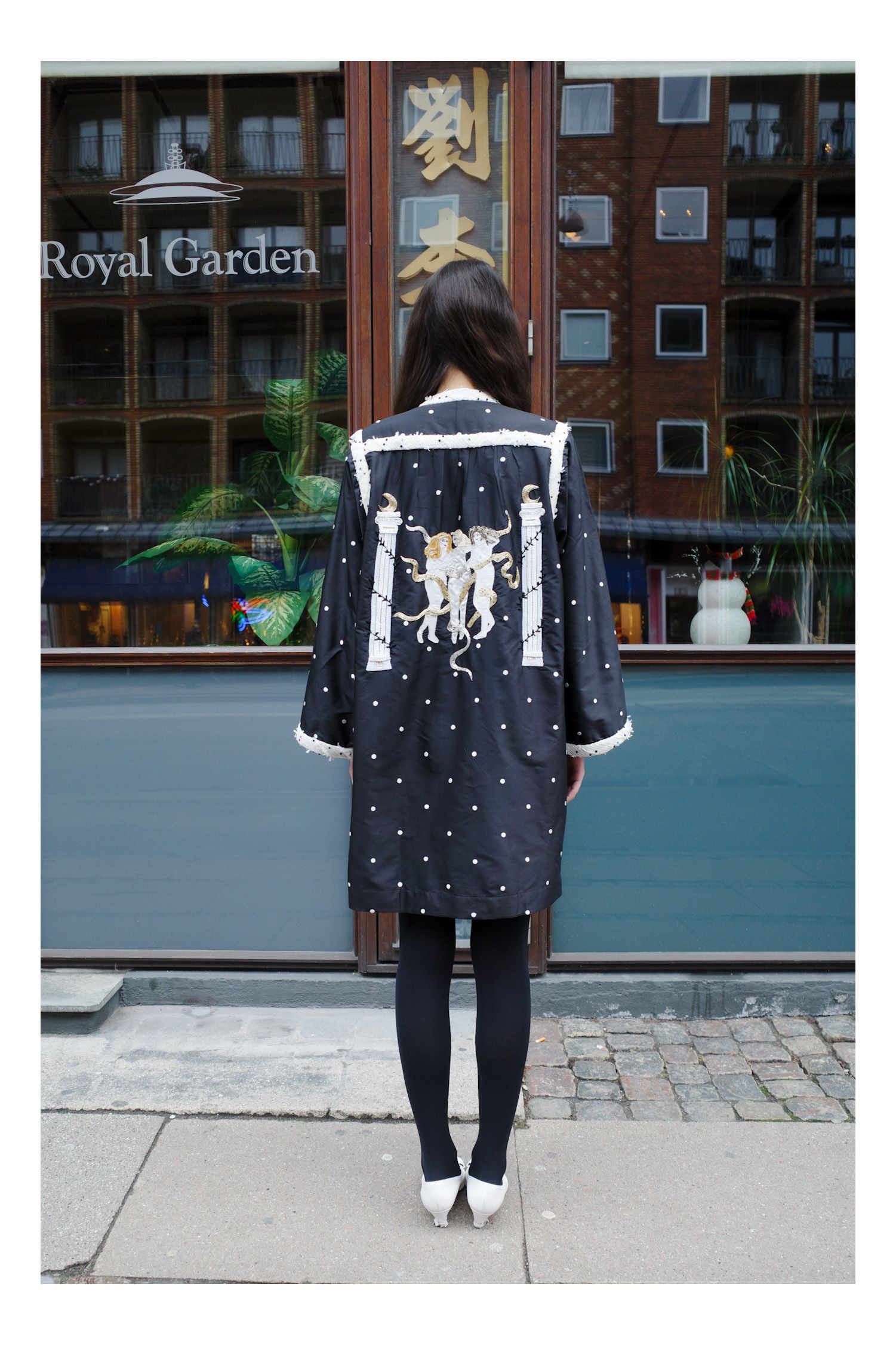 Image may contain clothing, outerwear, people, youth footwear and shoes