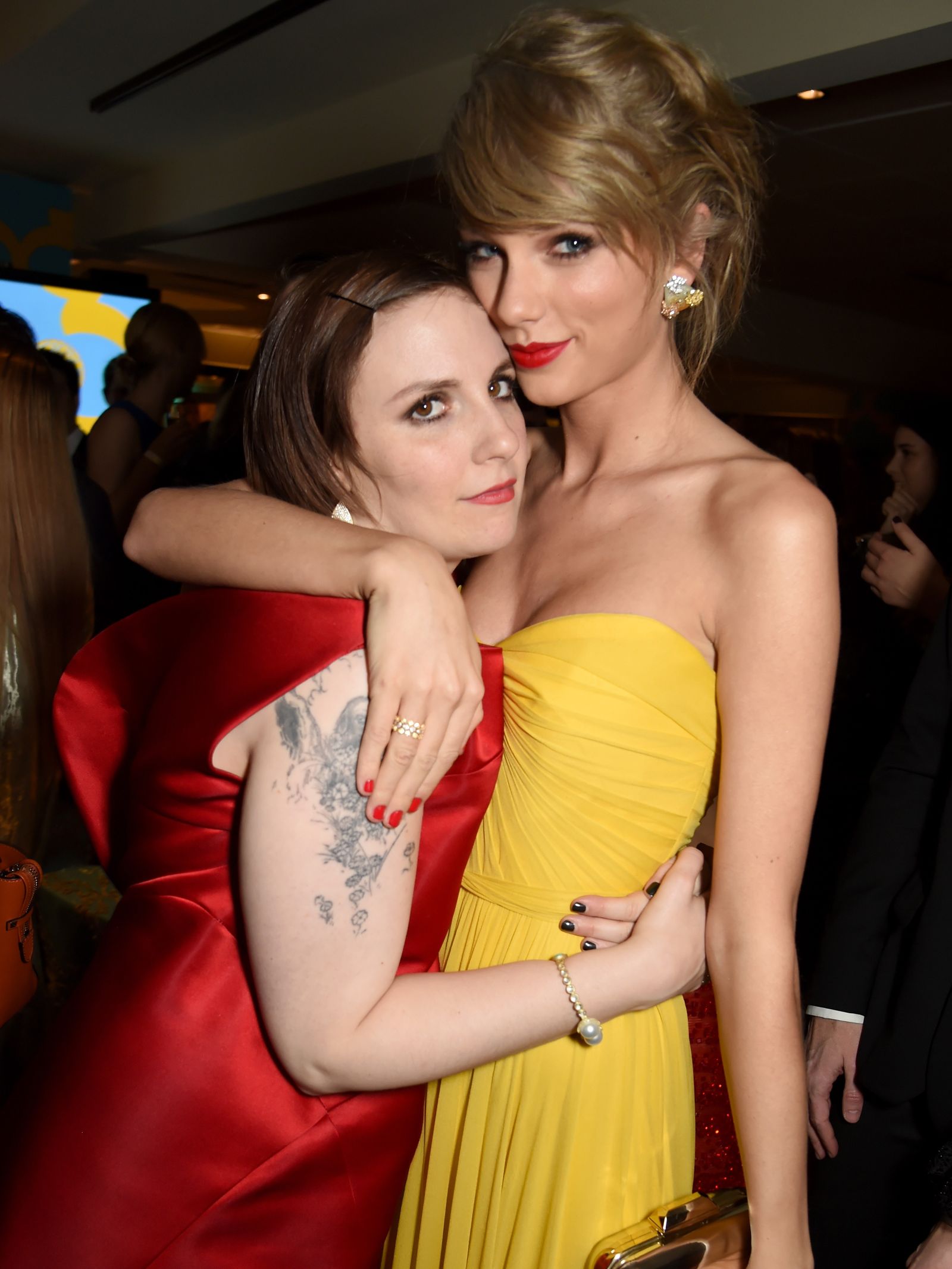 Image may contain Taylor Swift Lena Dunham clothing dress person skin tattoo formal evening dress and face