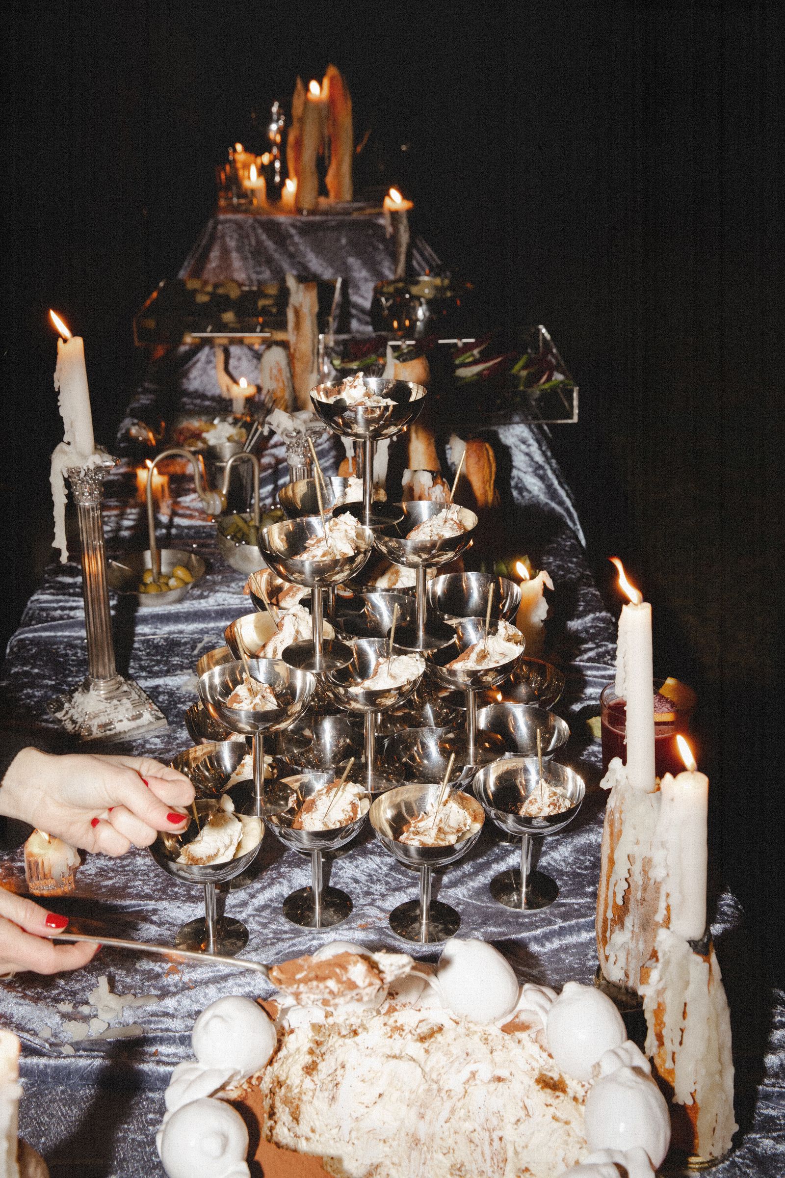 Image may contain dining table, furniture, table, altar building, architecture, church, prayer, baby and candles