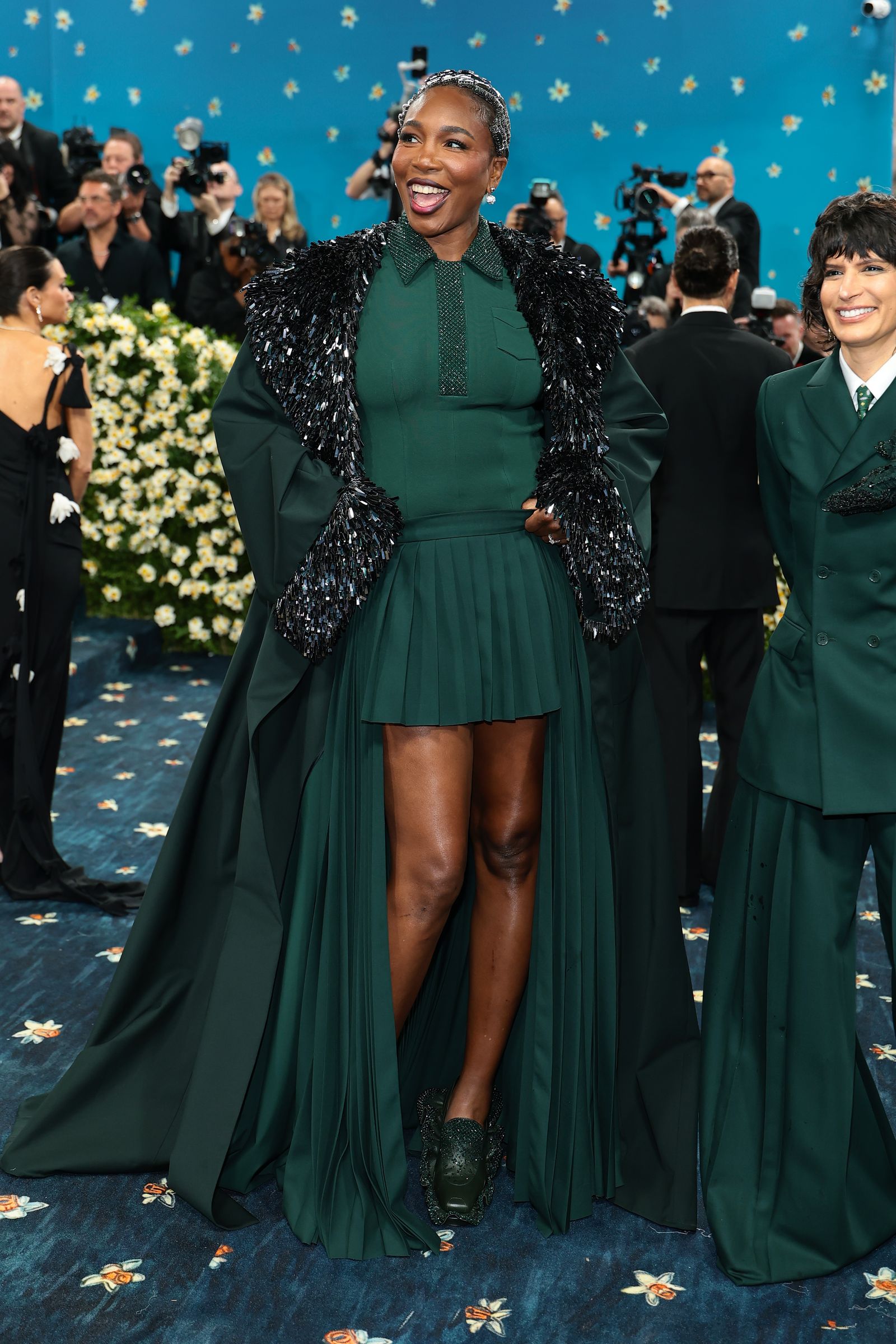 Image may contain Venus Williams Adult Wedding face, head, outfit, coat and happiness