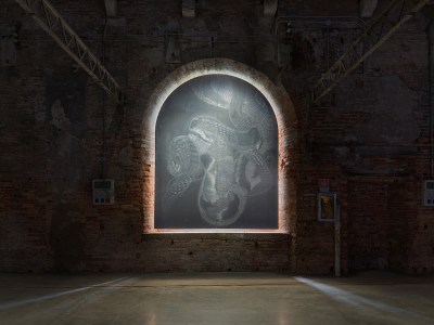 The arched windows are painted with serpentine patterns.