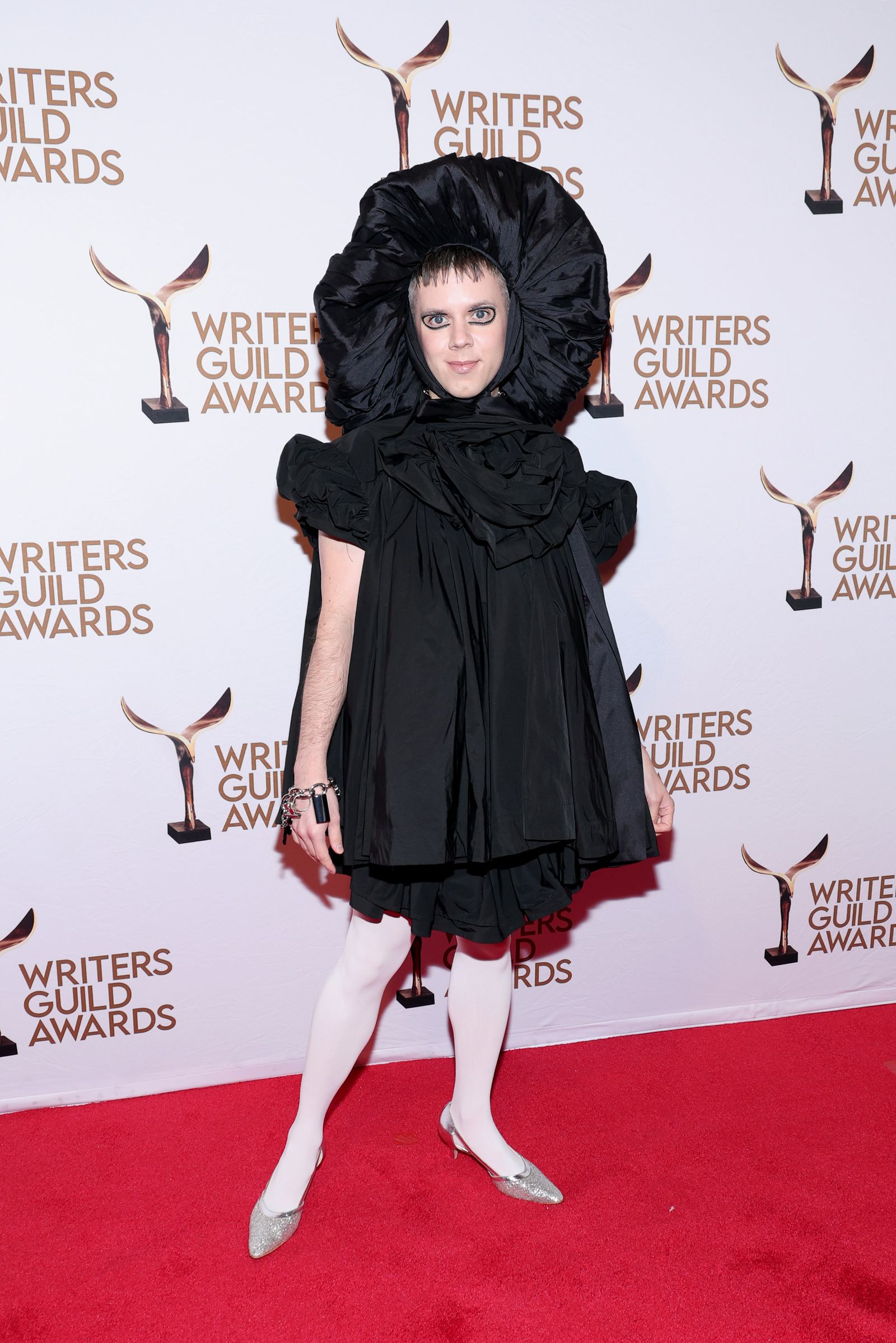 Image may contain Cole Escola fashion adult brunette hair clothing coats face premiere and shoes