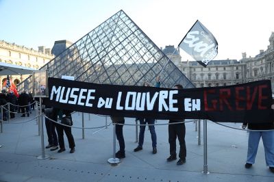 PARIS, FRANCE - DECEMBER 15: Museum staff protest after they voted to go on strike to protest worsening working conditions and safety breaches at the Louvre Museum in Paris, France on December 15, 2025. (Photo by Mohamad Salaheldin Abdelg Alsayed/Anadolu via Getty Images)