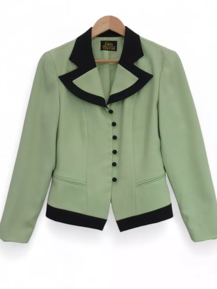 Image may contain: blazer, clothing, coat, jacket, shirt, formal wear and suit