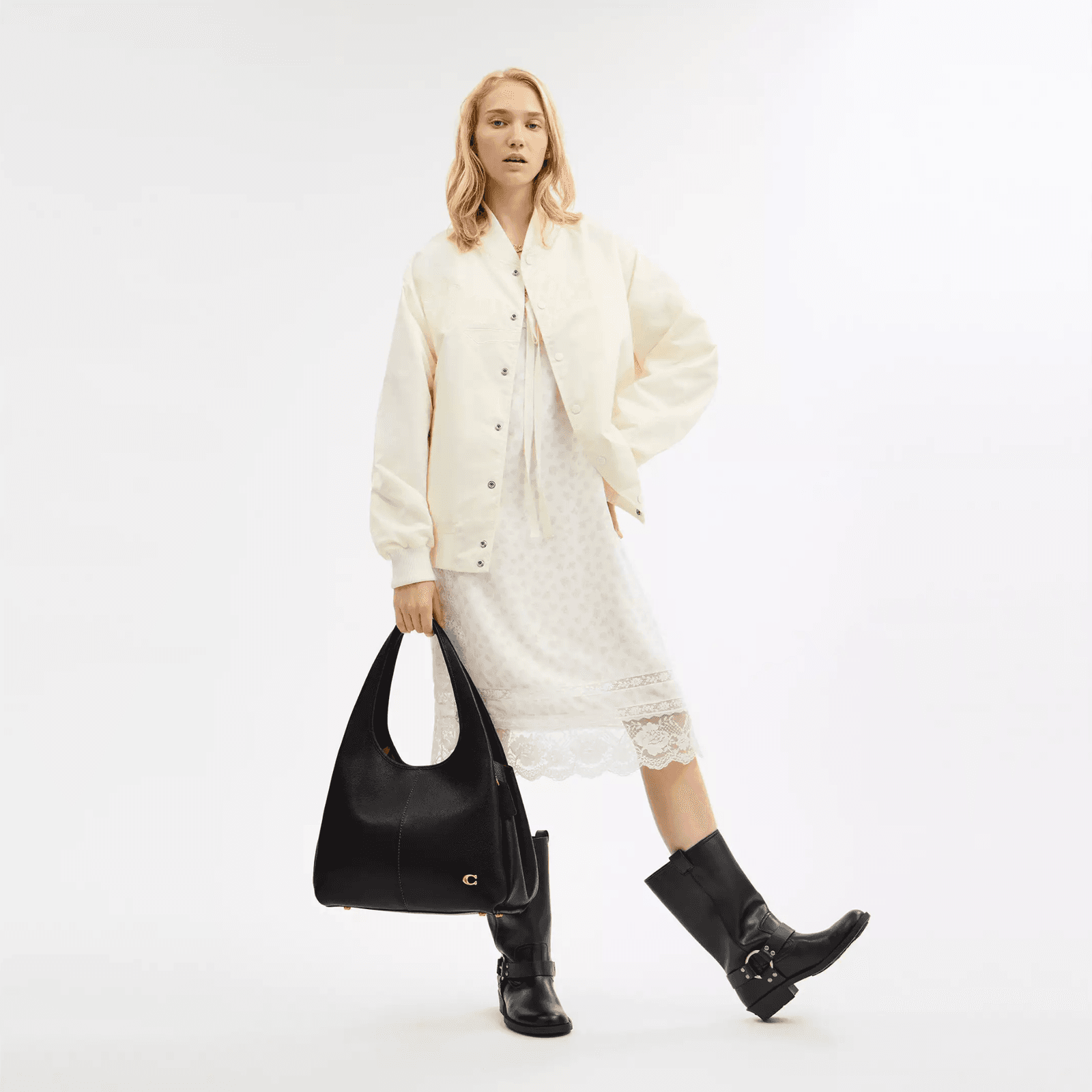 Image may contain clothing, outerwear, accessories, bag, tote, long sleeves, sleeves, adult and wallet