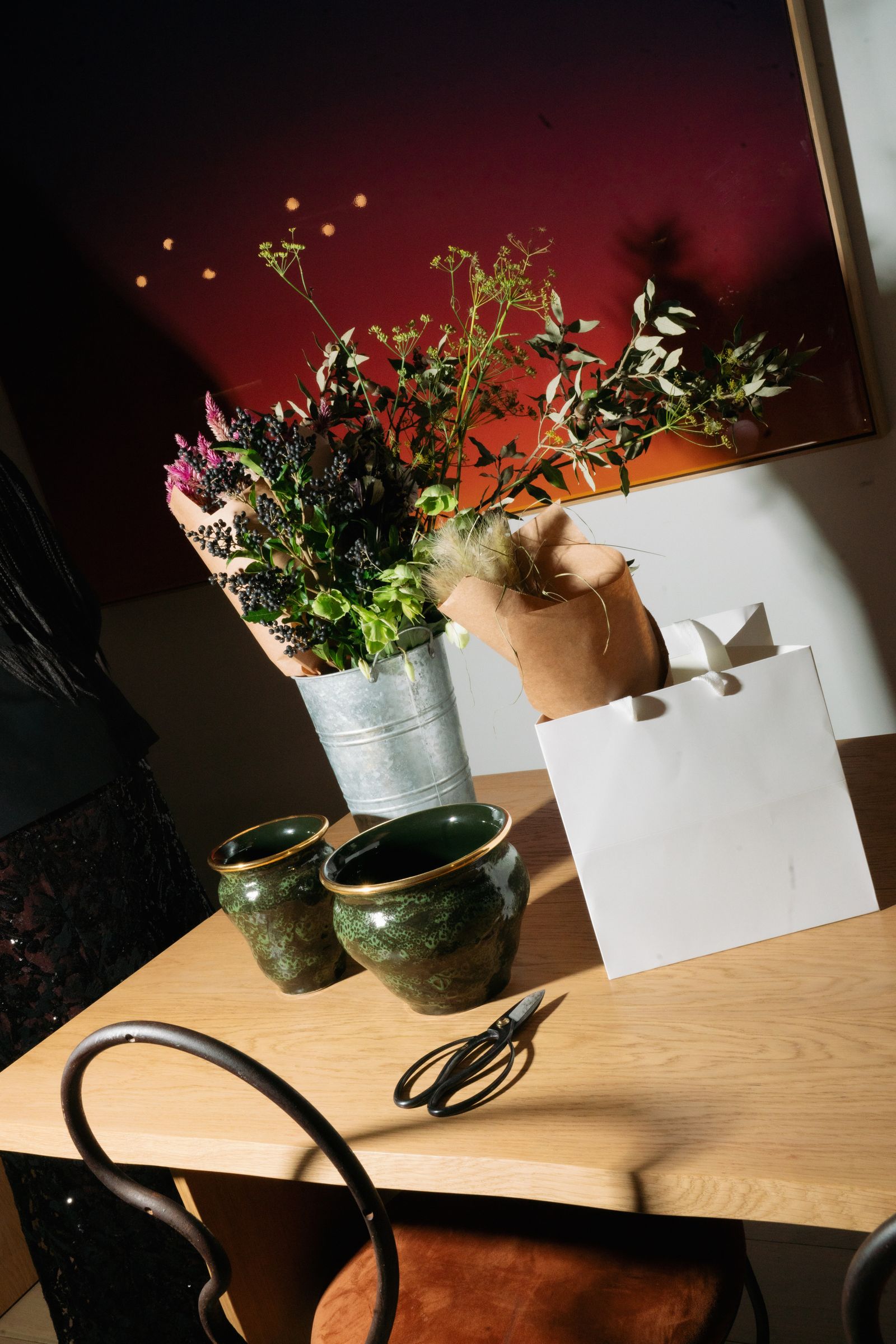 Pictures may contain plants, potted plants, flowers, flower arrangements, furniture, tables, adults and indoors