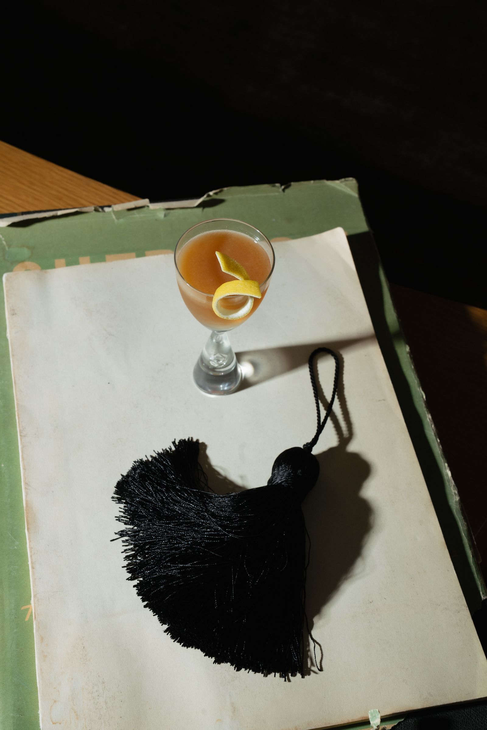 Images may contain alcoholic beverages, cocktails, furniture, tables, glasses and dining tables