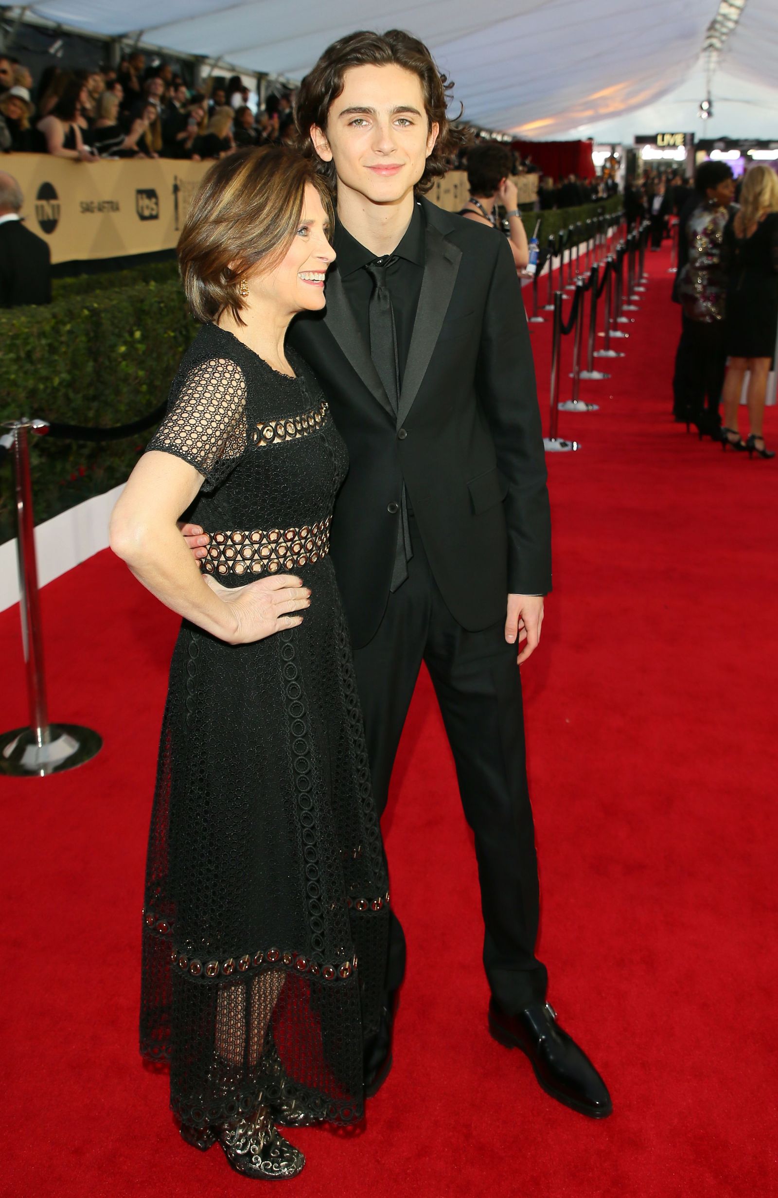 Timothee Chalamet and Nicole Flender arrive at the Shrine Expo to receive the 24th Annual Screen Actors Guild Awards.