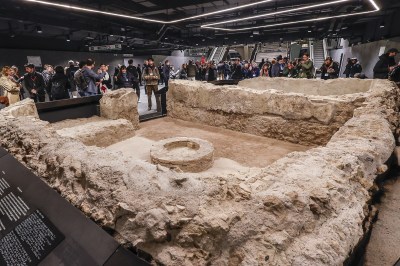 ROME, ITALY, DECEMBER 16: Journalists admire archaeological finds during the inauguration of the new Colosseo-Fori Imperiali station on Line C of the Rome Metro on December 16, 2025. The Eternal City has opened two new stations, including museums designed to enhance artifacts discovered during construction: Porta Metronia station along the C line, and Colosseo-Fori Imperiali station, which will connect with the B line to the original Colosseo station. (Photo: Riccardo De Luca/Anadolu via Getty Images)