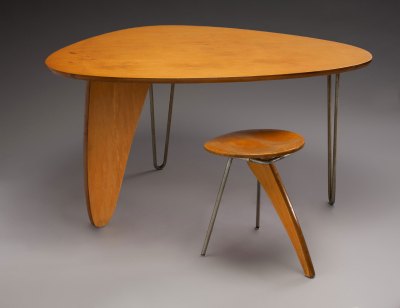 A table and matching stool with a wooden top and a wooden leg. The legs are metal with hairpins. Stools are metal cylinders.