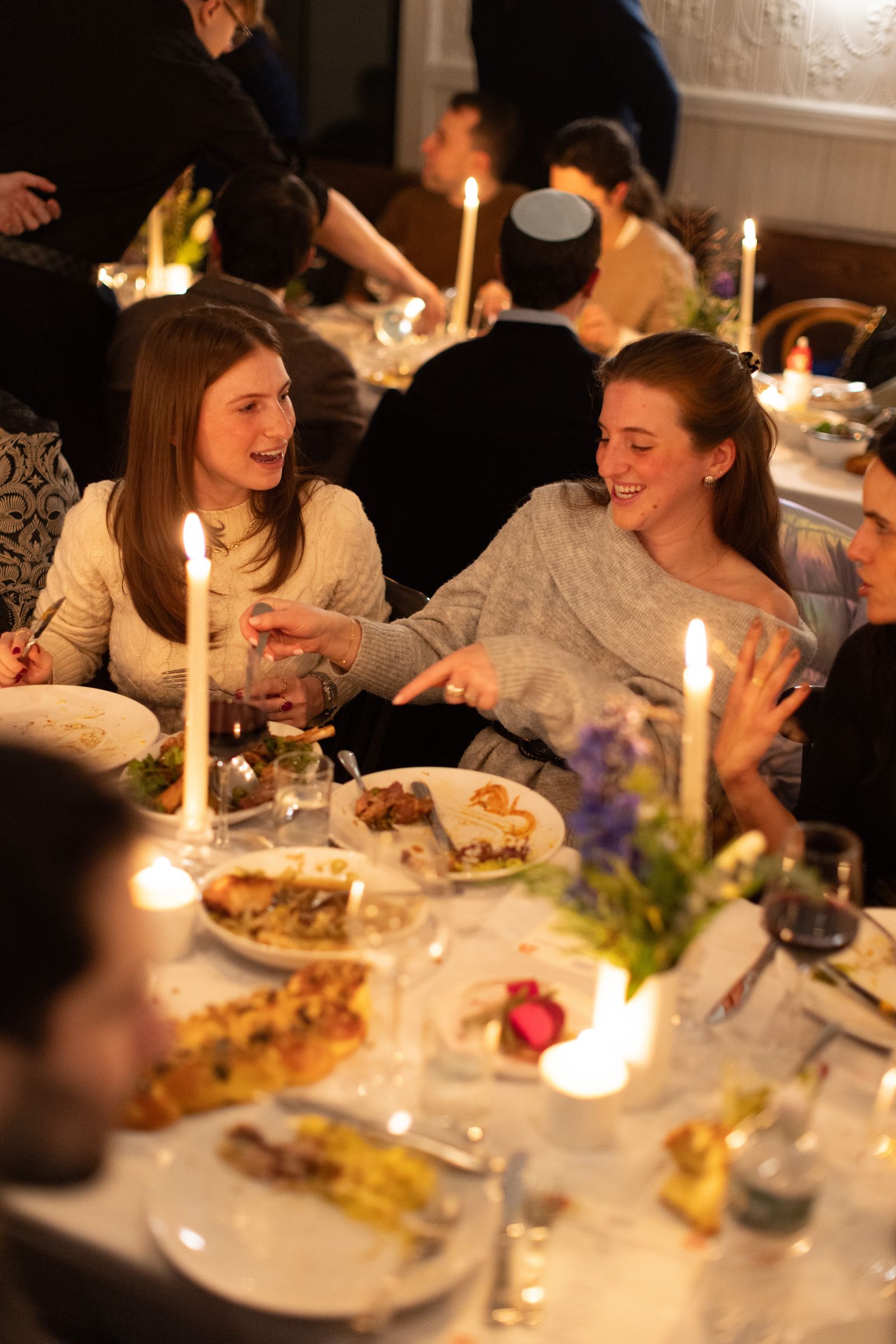 Image may contain people, dining table, furniture, table, building, architecture, restaurant, interior and room