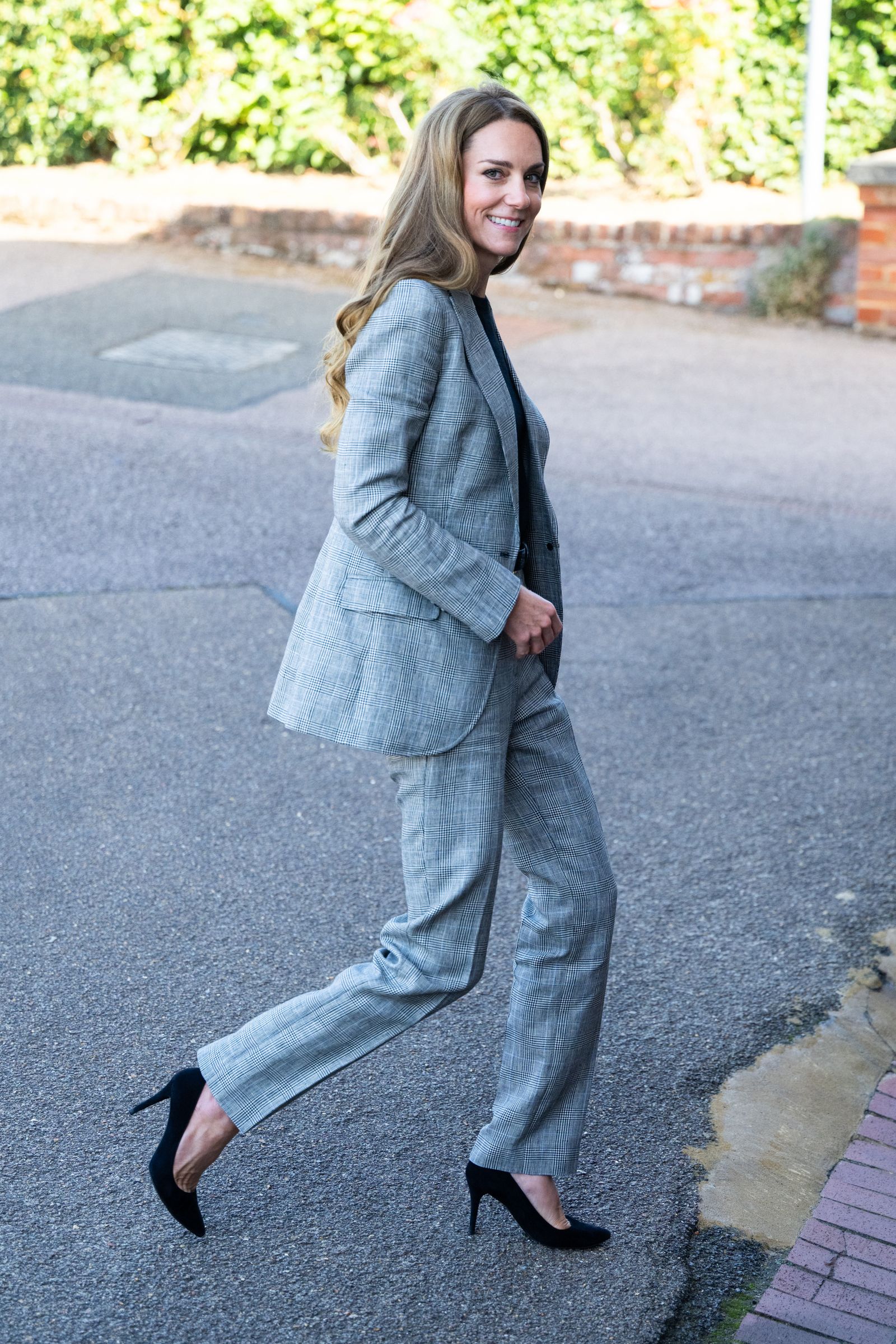 Pictures may contain clothing, pants, jeans, formal wear, blazers, jackets, footwear, shoes, adults and individuals