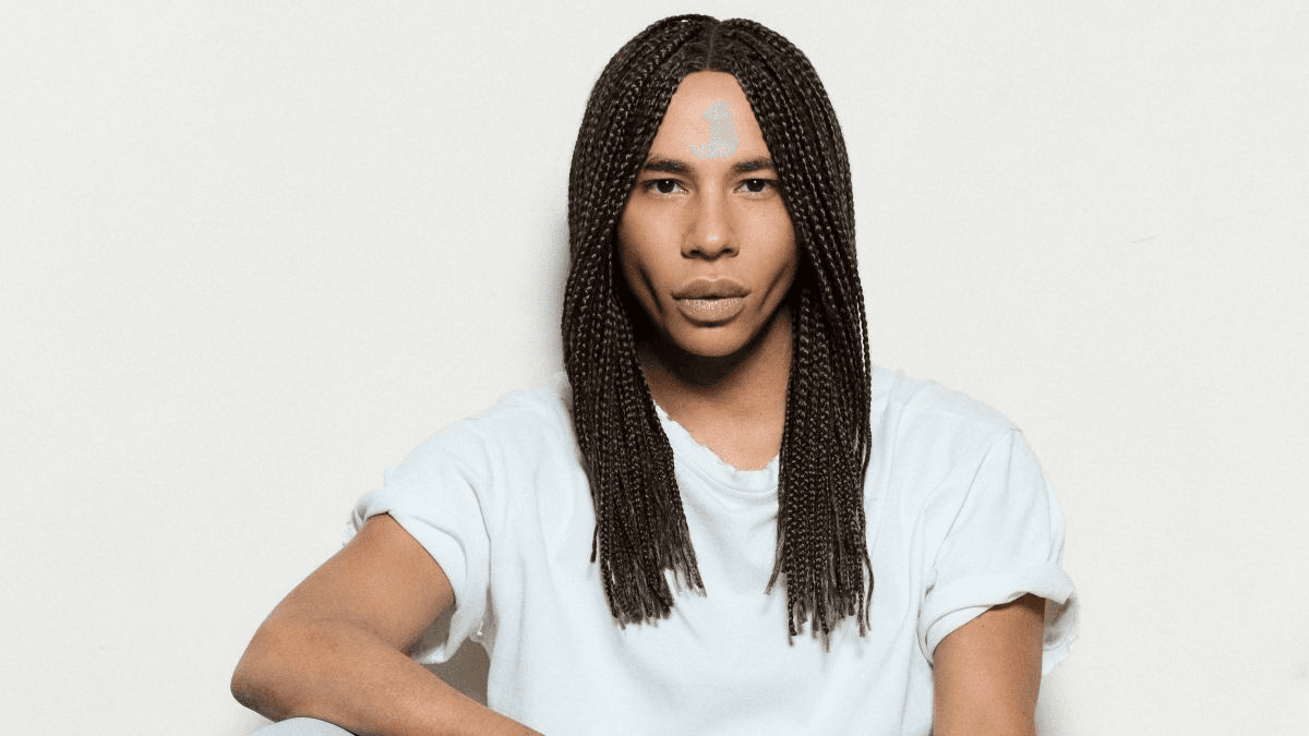 Image may contain Olivier Rousteing, clothing, scarf, hair, people and braids