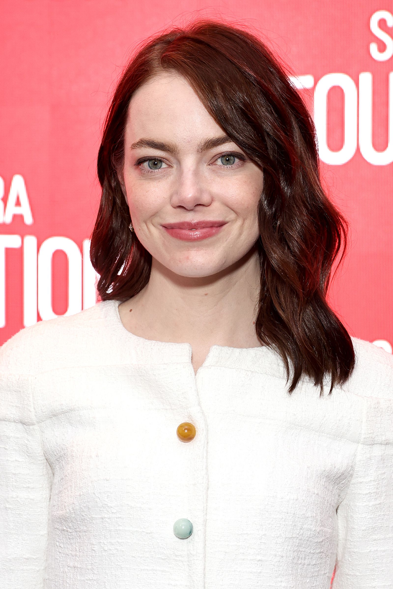 The image may contain Emma Stone Adult Head and Face Happy Smile Photography Portrait and Dimples