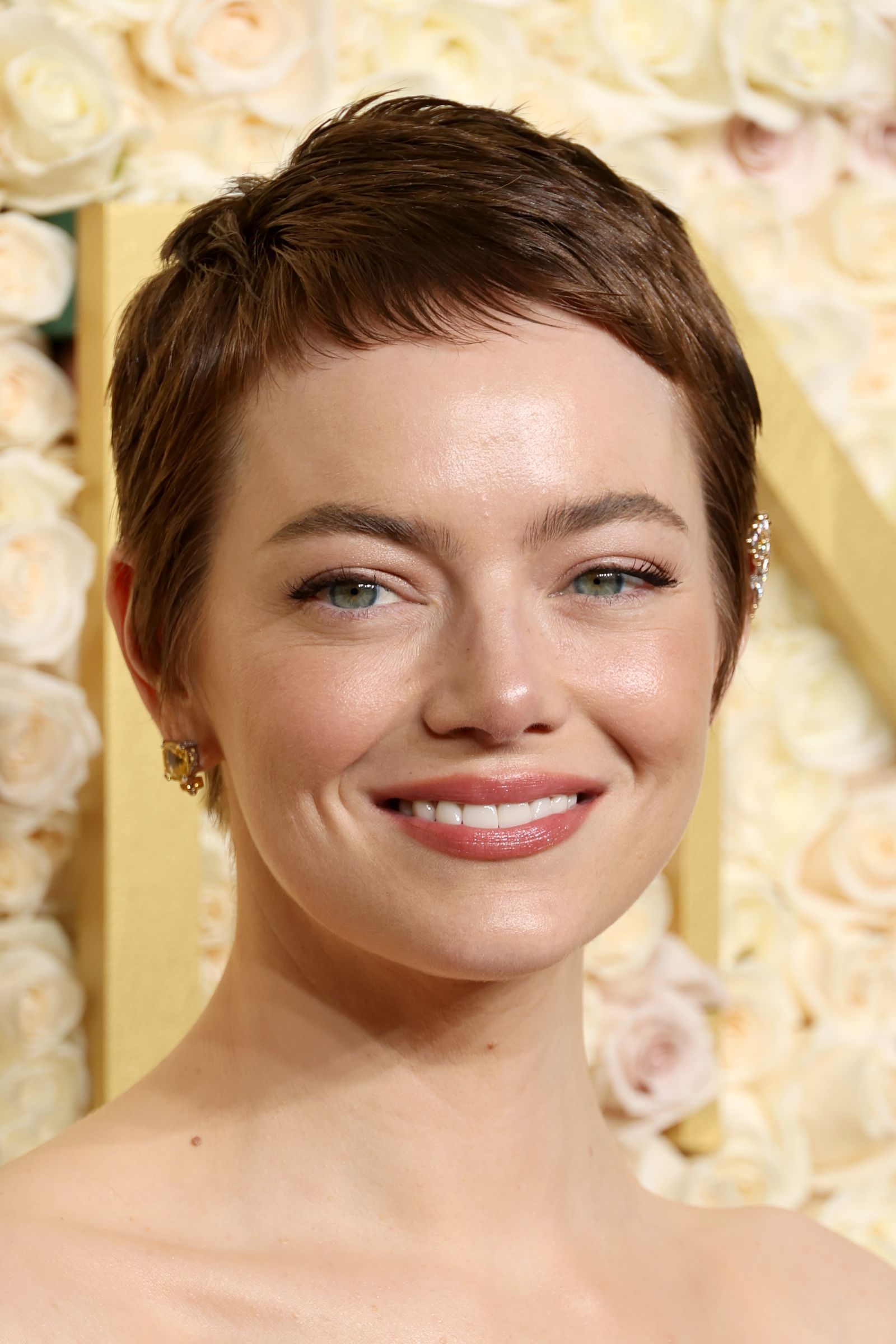 Image may contain Emma Stone head face happy smile body part neck adult wedding and hair