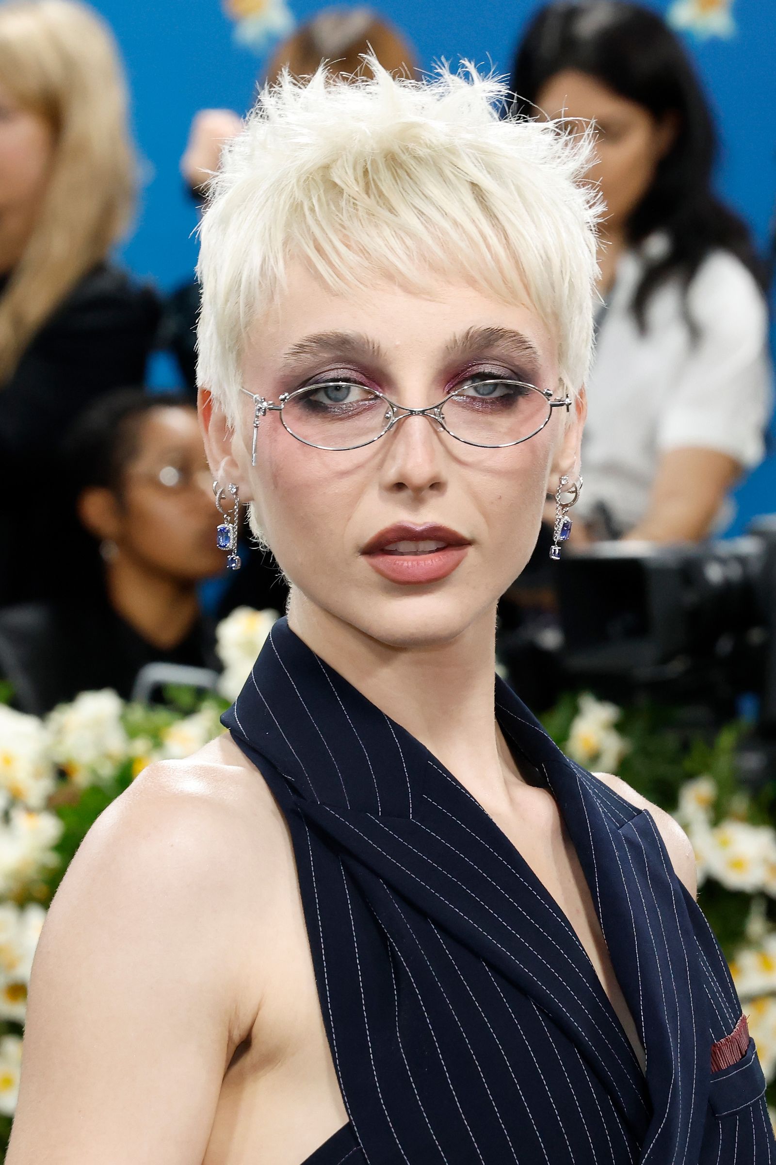 Image may contain Emma Chamberlain blonde adult accessories glasses children elf face and head