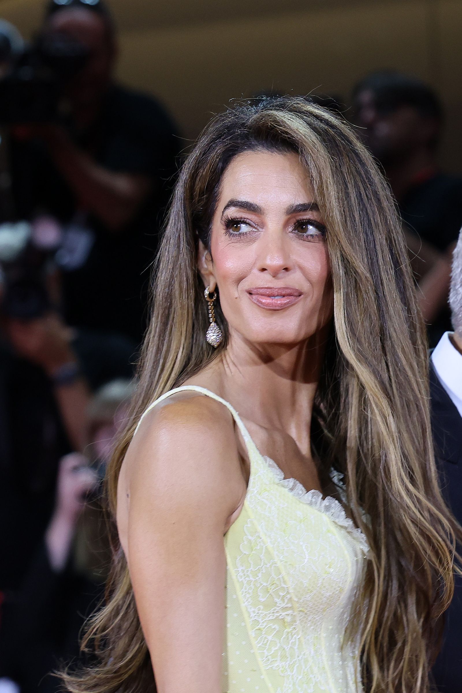 Image may contain Amal Clooney Hair Highlighted Hair Human Head Face Happy Smile Blonde Adult and Wedding