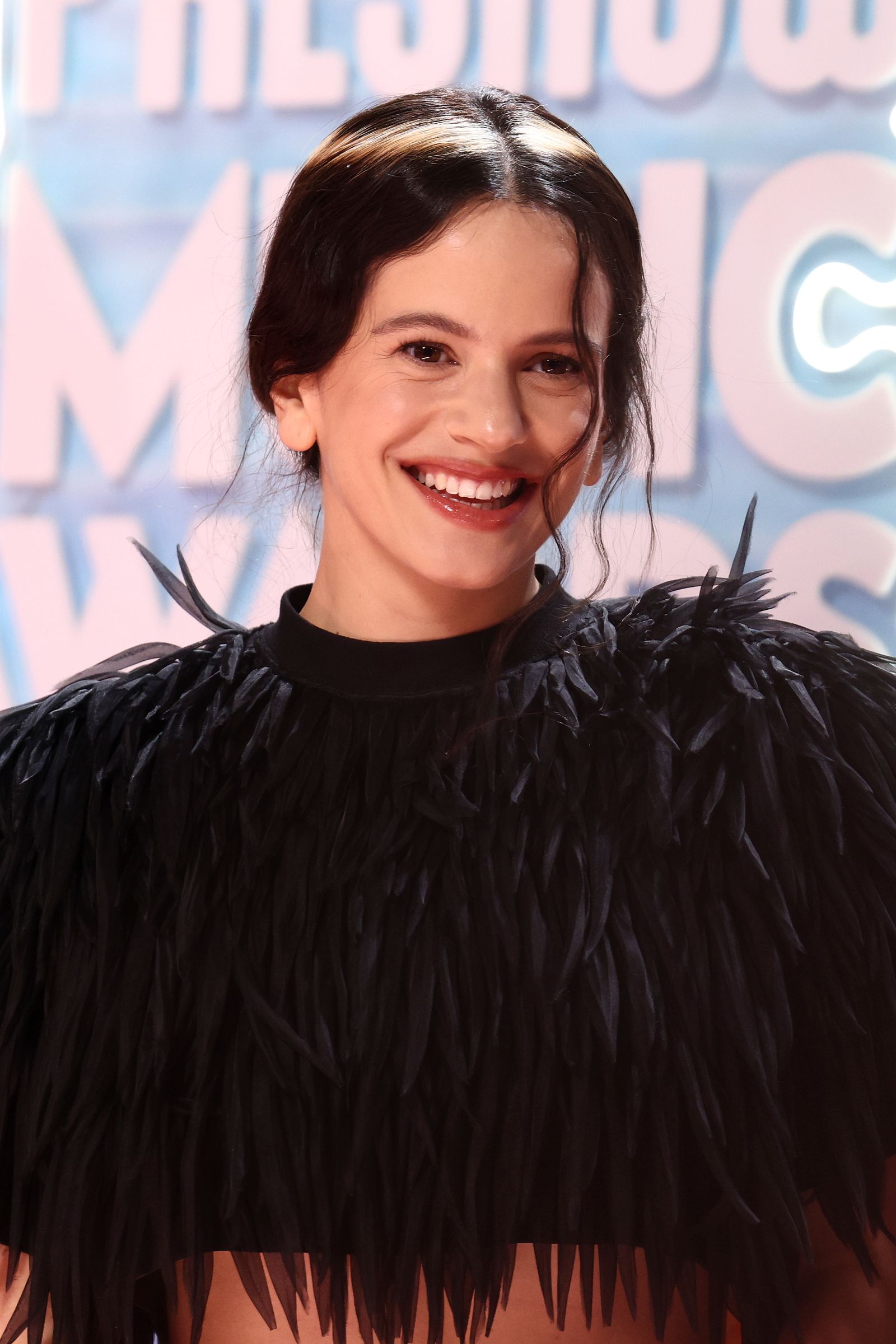 Image may contain Rosalía facing Happy Head Person Smile Adult and Dimples