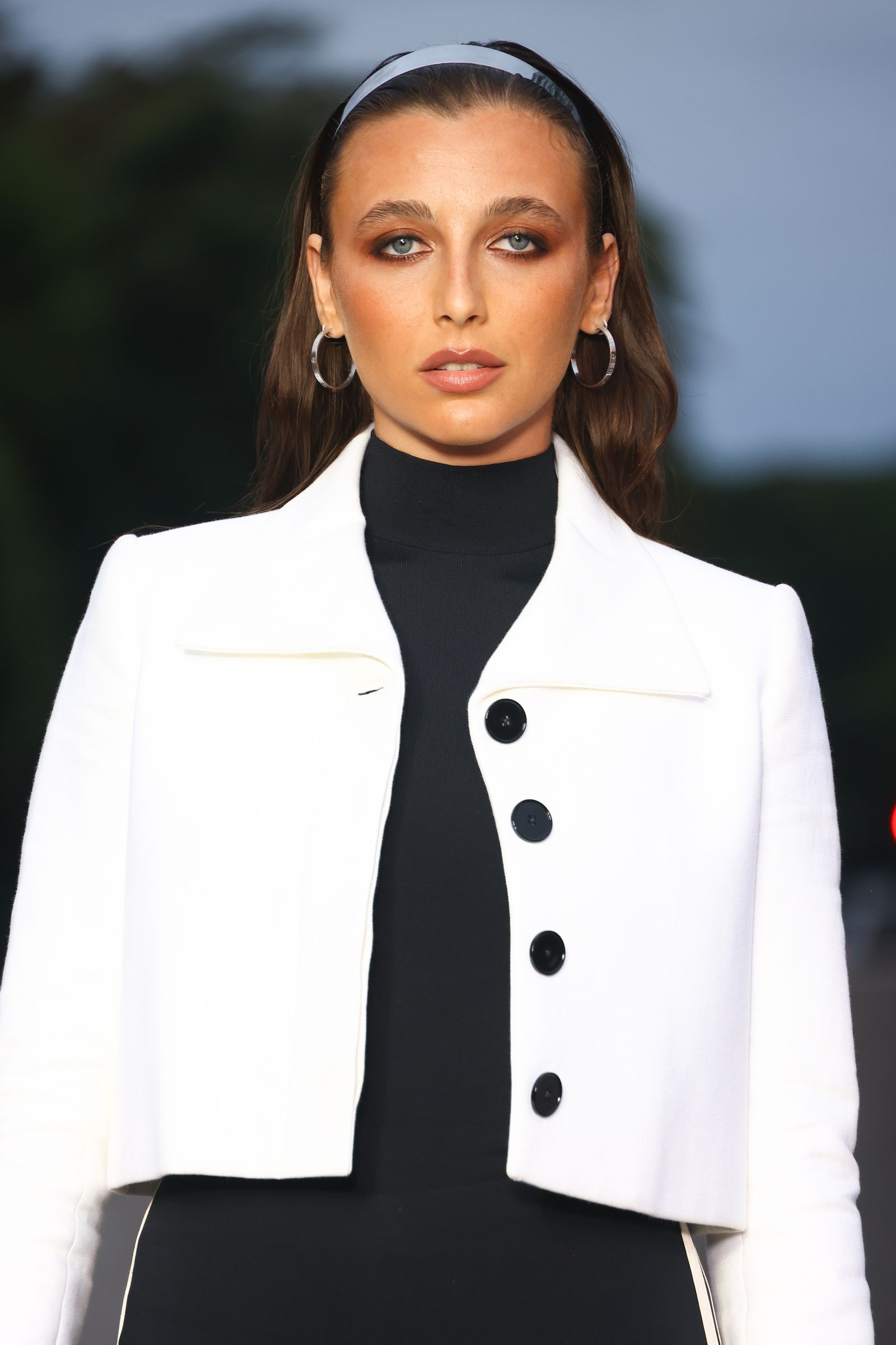 Image may contain Emma Chamberlain Clothing Coat Blazer Jacket Formal Wear Suit Face Head People and Photography