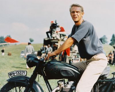 Actor Steve McQueen sitting astride a motorcycle in a publicity still for the 1963 film The Great Escape.