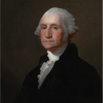 Portrait of George Washington wearing ruffled shirt and black coat, looking at viewer.
