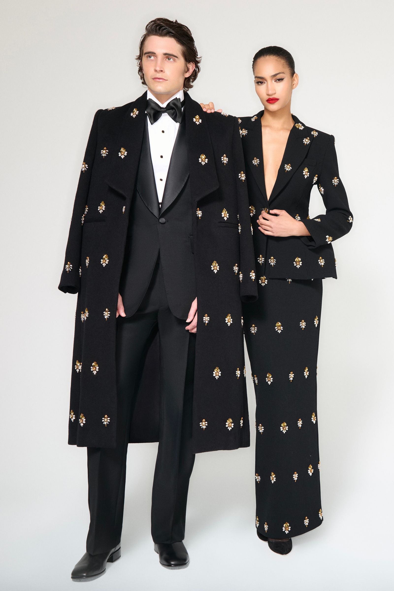 Image may contain Jack Laskey Naima Mora Clothing Jackets Formal Suits Tuxedos Adult Jackets and Dresses