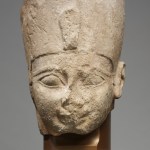 A sculpture of a weathered head.