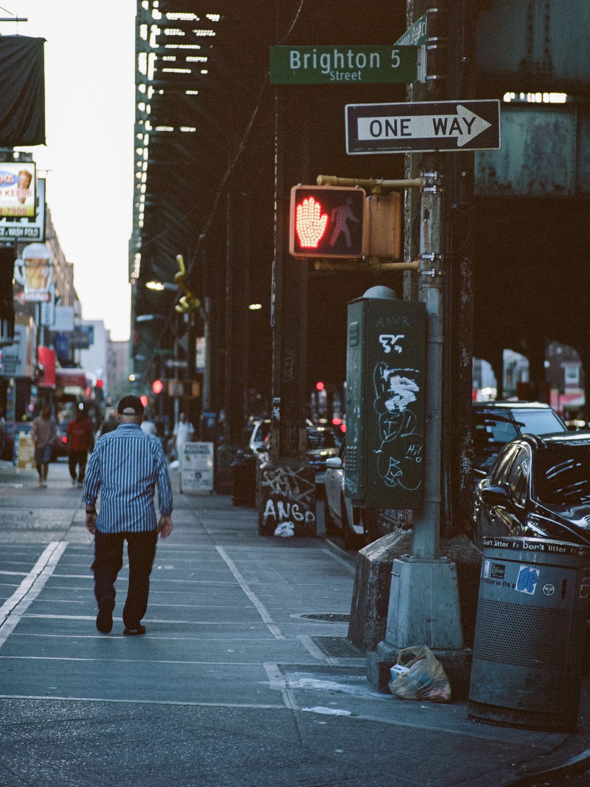 Image may contain city roads, streets, city adult pedestrian lights, traffic lights, paths, accessories and bags