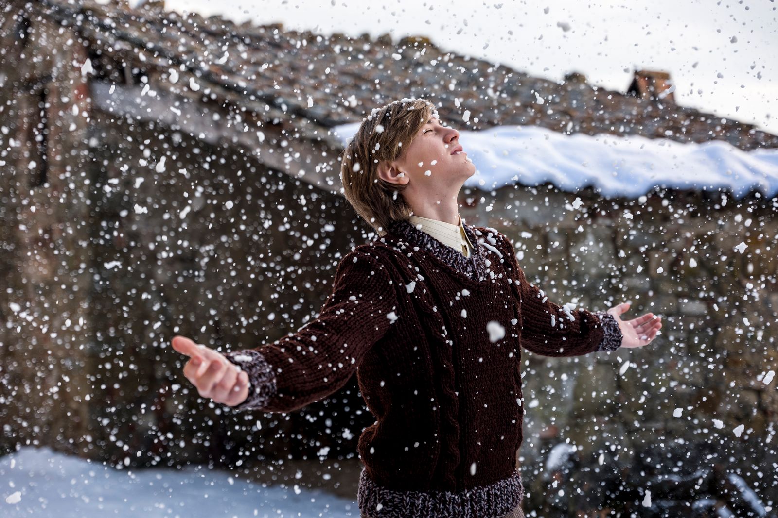 Image may contain nature outdoor adult human face head photography portrait snow snowball fight and clothing
