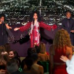 Diana Ross appeared on stage in a red and silver gown.