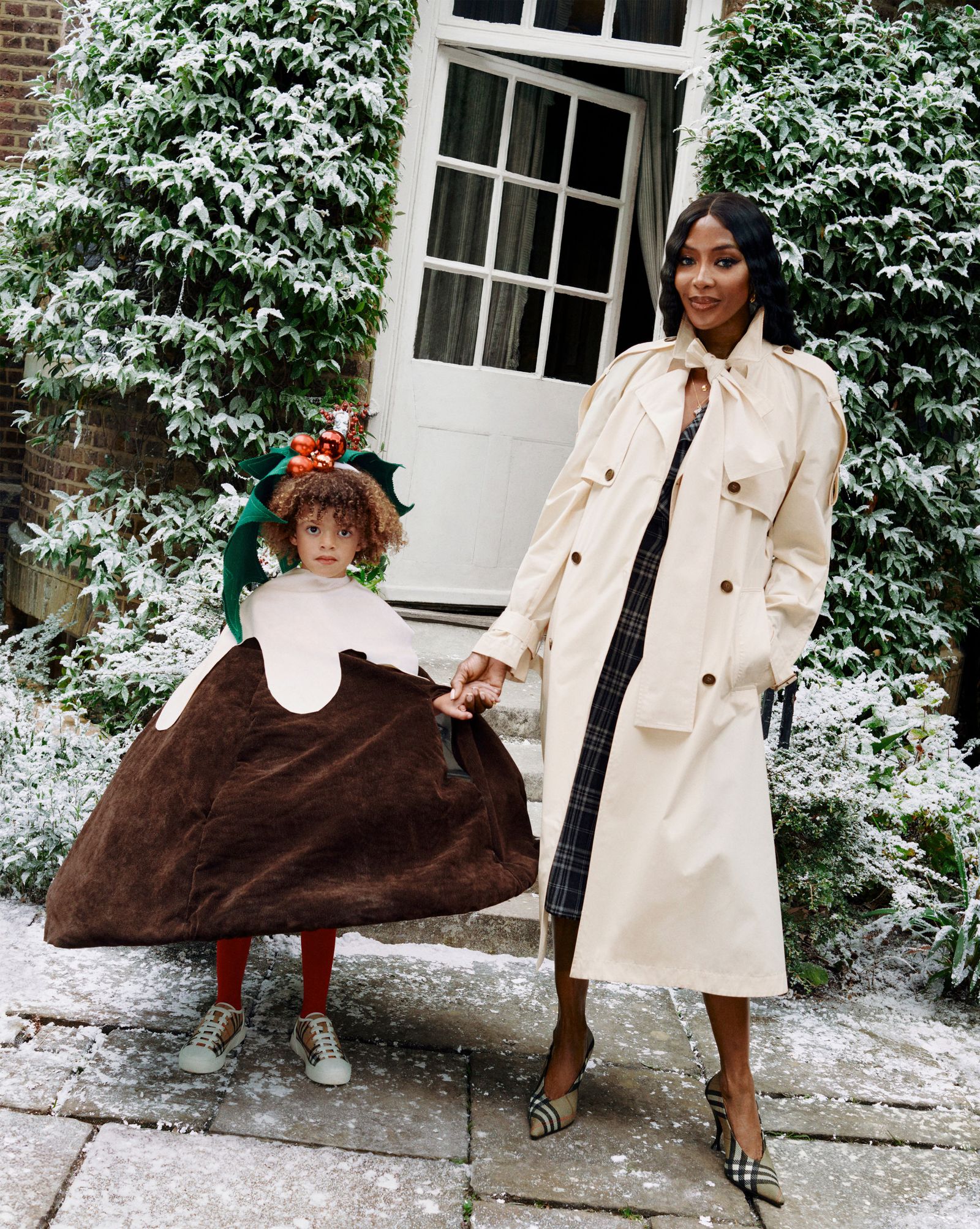 Image may contain Naomi Campbell people costume coat children's coat face and head