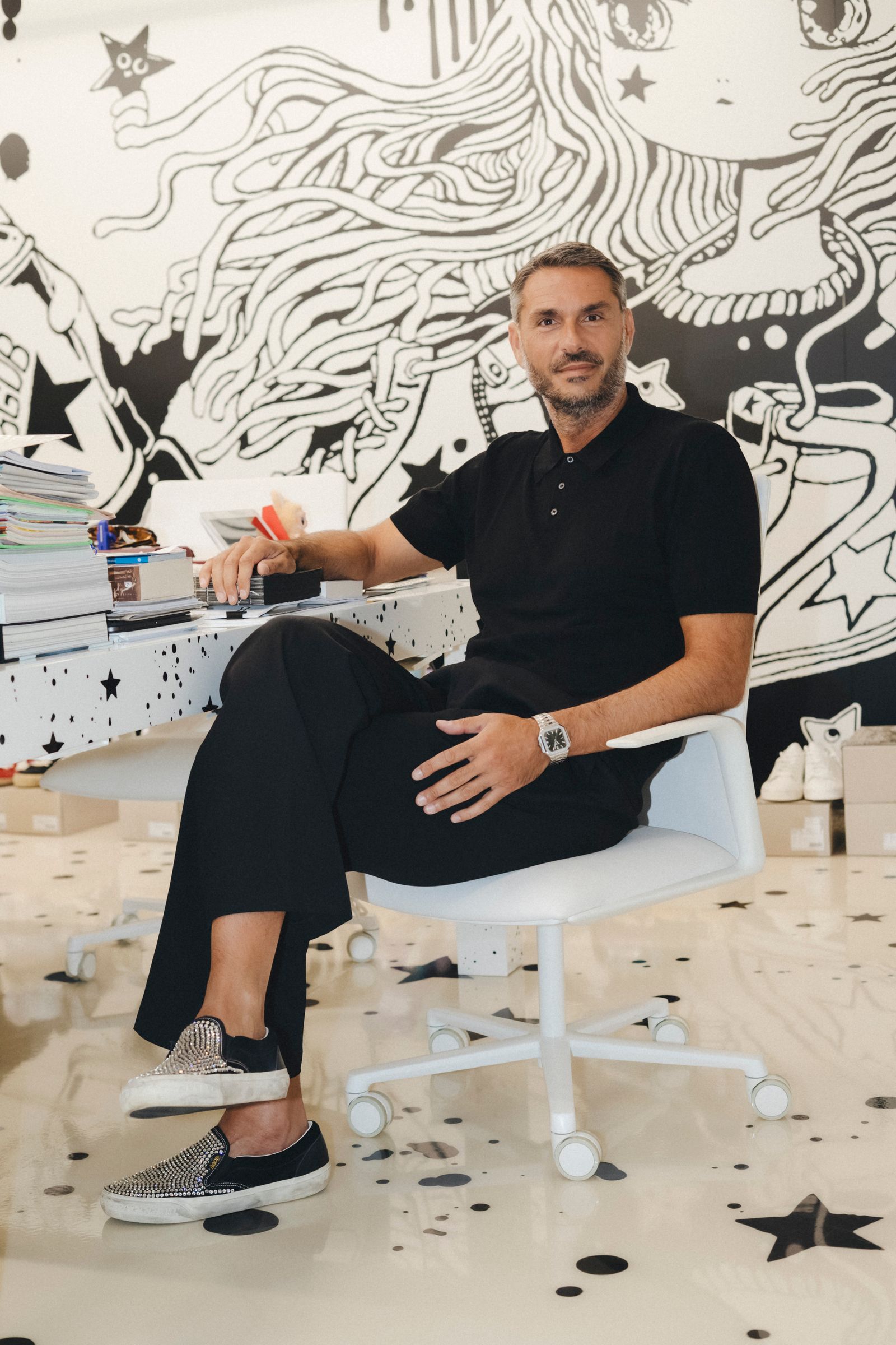 Image may contain the face and head of an adult sitting indoors