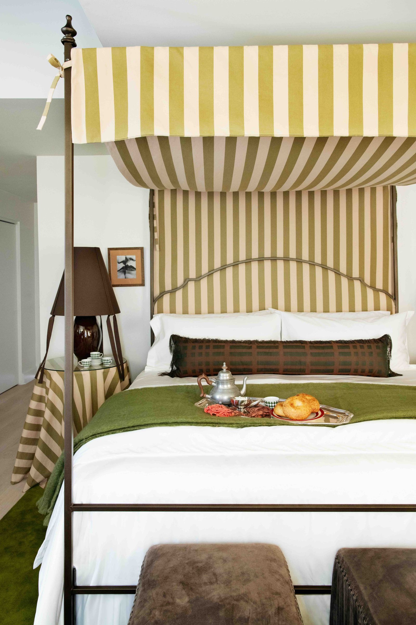 Image may contain furniture, bed, bedroom, interior, art, painting, lamp, bread, food and canopy bed
