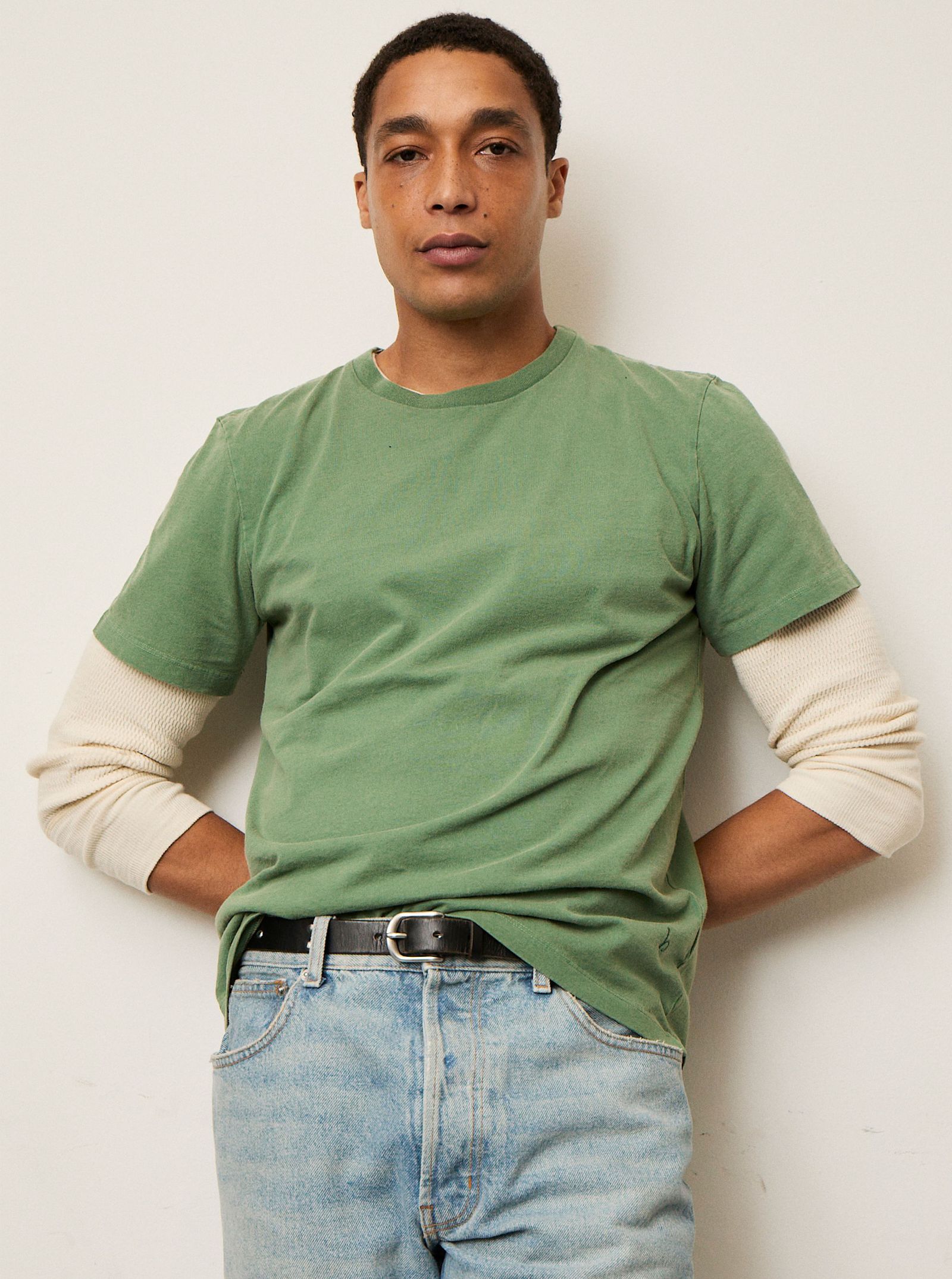 Image may contain clothing t-shirt, sleeves, shirt, adult, accessories, jeans, pants and buckle