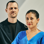 A man and a woman standing next to each other.