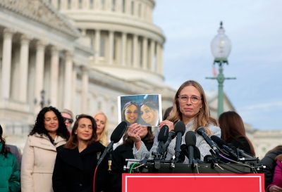 WASHINGTON, DC - NOVEMBER 18: Epstein abuse survivor Annie Farmer holds up a young photo with her sister Maria Farmer during a press conference with lawmakers on the Epstein Documents Transparency Act outside the U.S. Capitol on November 18, 2025 in Washington, DC. The House of Representatives is expected to vote today on a bill that would direct the U.S. Department of Justice to release all documents related to late accused sex trafficker Jeffrey Epstein. (Photo by Heather Diehl/Getty Images)