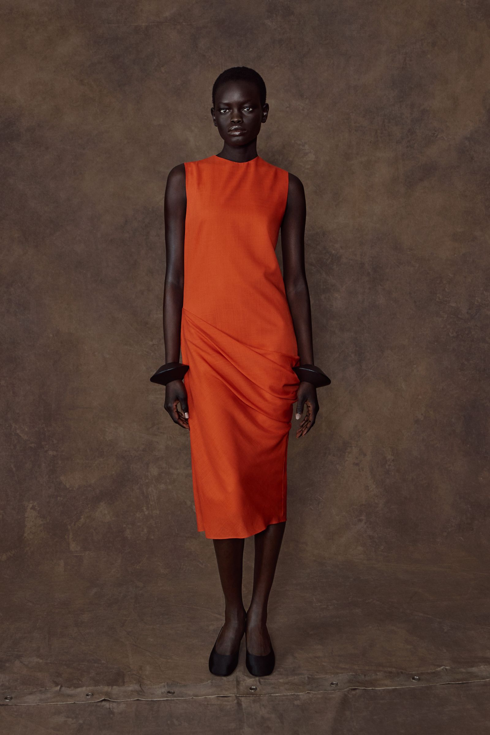 Image may contain standing faces and heads