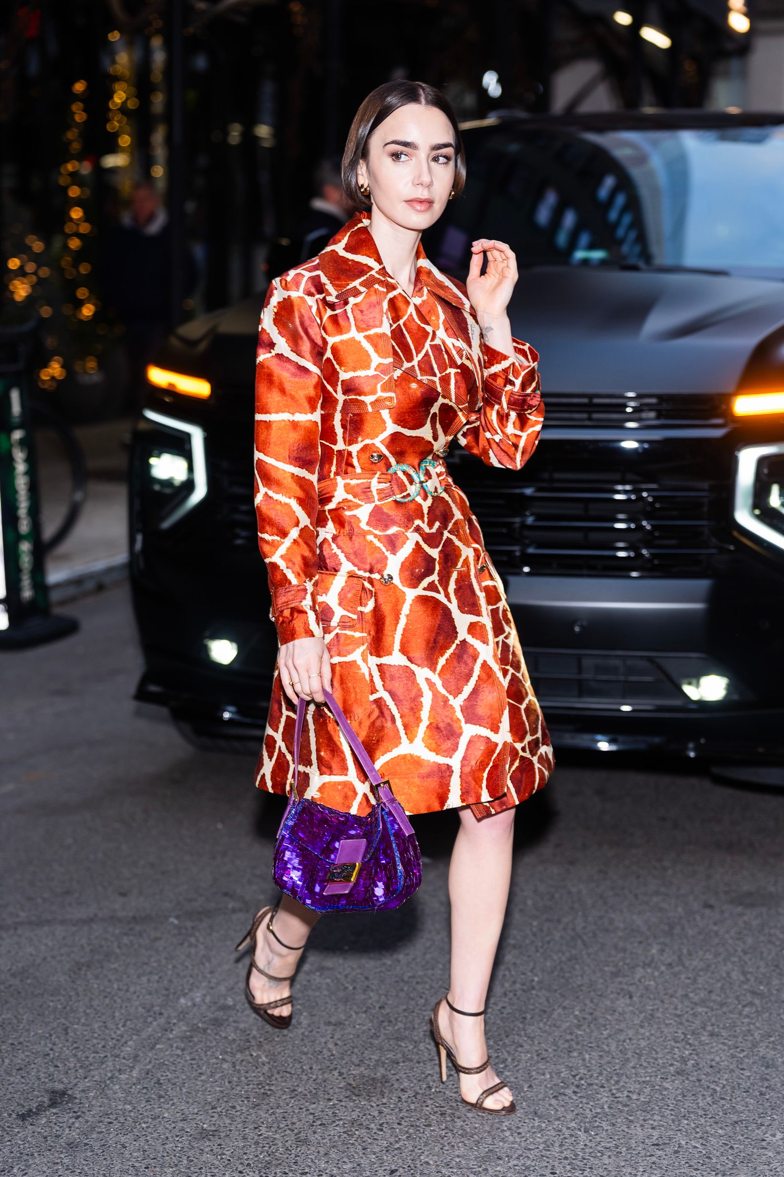 Images may contain Lily Collins clothing, outerwear, adult accessories, bags, handbags, footwear, shoes and dresses