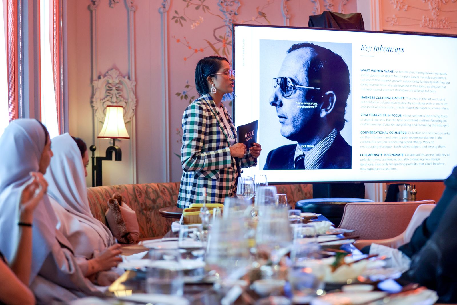 Image may contain architecture, building, restaurant, dining table, furniture, interior, table, sofa and adults