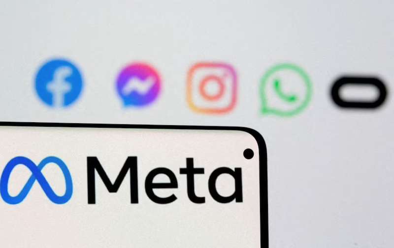 Facebook's new rebrand logo Meta is seen on smartphone in front of displayed logo of Facebook, Messenger, Instagram, Whatsapp and Oculus in this illustration picture taken October 28, 2021. REUTERS/Dado Ruvic/Illustration/File Photo Acquire Licensing Rights