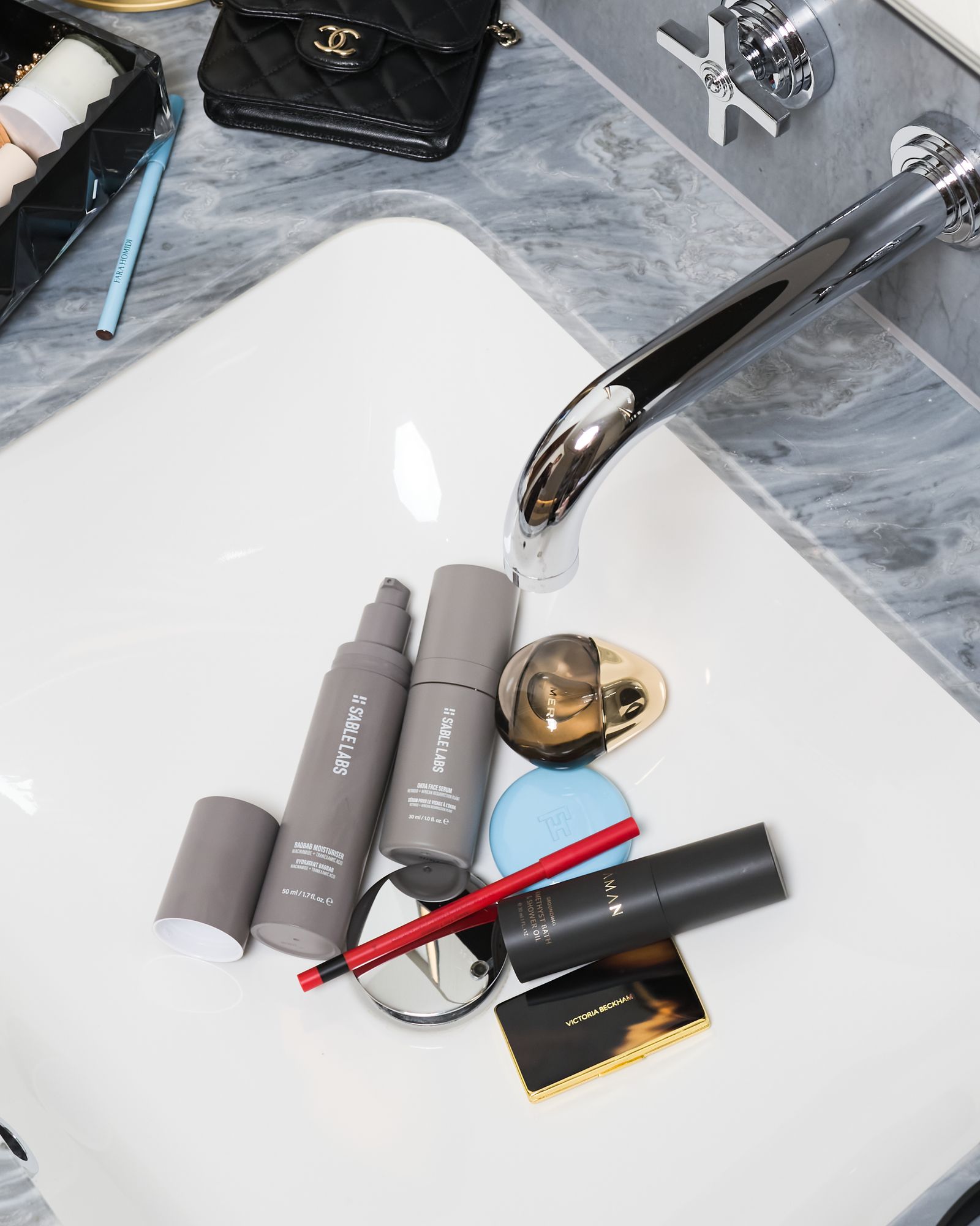 Images may contain washbasins, sinks, sinks, taps, accessories, bags, handbags and cosmetics