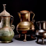 On the left is an Asante kettle (c. 1340-1405, British), and two smaller kettles (15th century British or European), also looted from the Kumasi palace by British troops