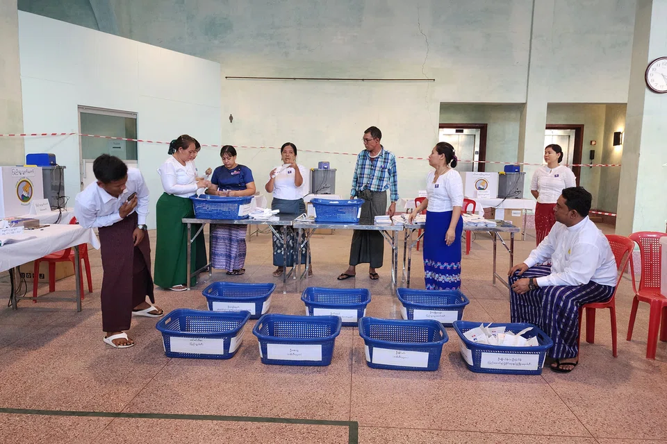 Soldiers with guns, short voter queues: Myanmar goes to the polls for first time since 2021 coup