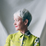 A woman wearing green clothes.