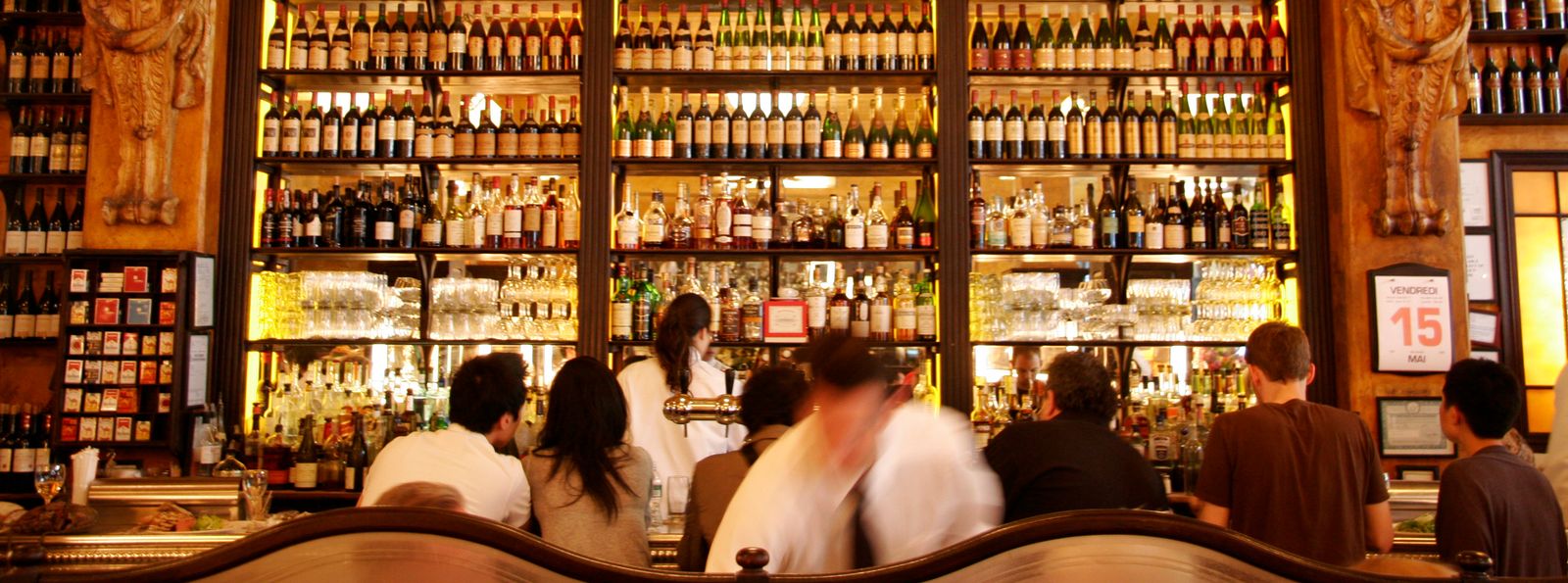 Picture may contain bar alcoholic beverage bottles liquor wine bottles adult wedding bar and bar counter